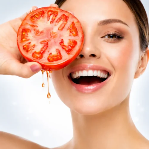 Tomato face mask for glowing skin with fresh tomatoes on a wooden table.