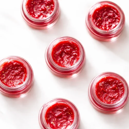 DIY strawberry lip balm recipe with natural ingredients for tinted lip care.